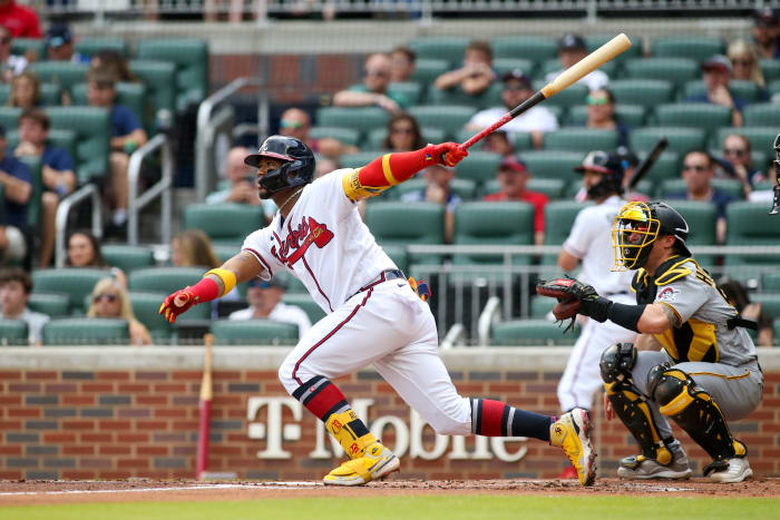 Jun 11, 2022; Atlanta, Georgia, USA; Atlanta Braves right fielder Ronald Acuna Jr. (13) hits a home run against the Pittsburgh Pirates in the first inning at Truist Park.